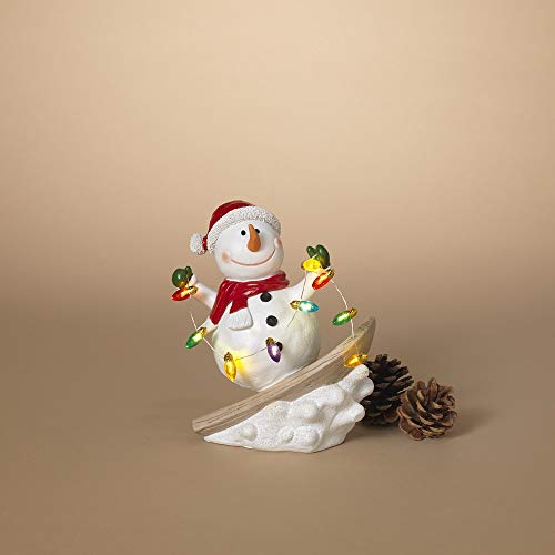 Gerson 2603900 Battery Operated Lighted Resin Skiing Snowman with Light String 7.4" H